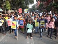 Job seekers and teachers shout slogans demanding the requirement for fifty thousand vacant posts as they take part in a protest march in Kol...