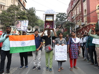 Job seekers and teachers shout slogans demanding the requirement for fifty thousand vacant posts as they take part in a protest march in Kol...