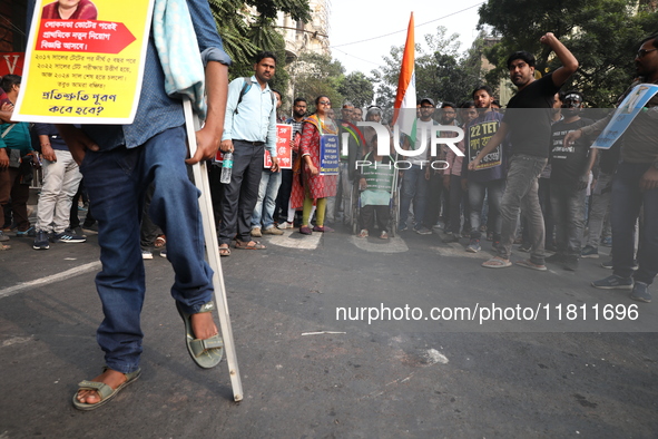 Job seekers and teachers shout slogans demanding the requirement for fifty thousand vacant posts as they take part in a protest march in Kol...