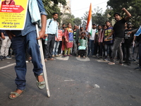 Job seekers and teachers shout slogans demanding the requirement for fifty thousand vacant posts as they take part in a protest march in Kol...