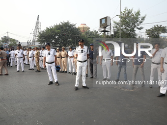 Job seekers and teachers shout slogans demanding the requirement for fifty thousand vacant posts as they take part in a protest march in Kol...