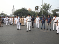 Job seekers and teachers shout slogans demanding the requirement for fifty thousand vacant posts as they take part in a protest march in Kol...