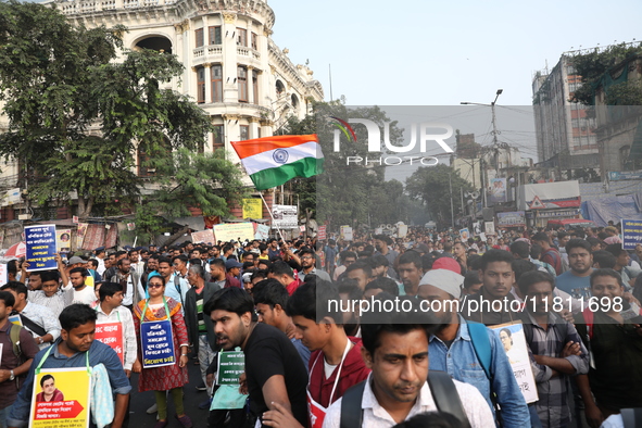 Job seekers and teachers shout slogans demanding the requirement for fifty thousand vacant posts as they take part in a protest march in Kol...