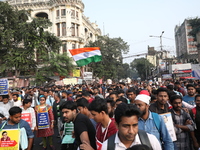 Job seekers and teachers shout slogans demanding the requirement for fifty thousand vacant posts as they take part in a protest march in Kol...