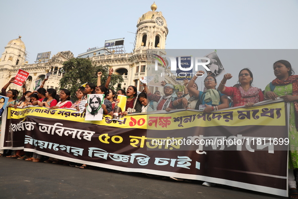 Job seekers and teachers shout slogans demanding the requirement for fifty thousand vacant posts as they take part in a protest march in Kol...