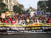 Job seekers and teachers shout slogans demanding the requirement for fifty thousand vacant posts as they take part in a protest march in Kol...