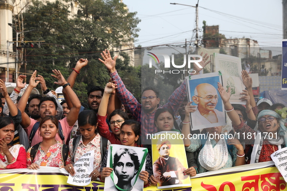 Job seekers and teachers shout slogans demanding the requirement for fifty thousand vacant posts as they take part in a protest march in Kol...