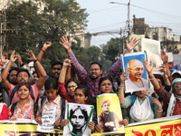 Job seekers and teachers shout slogans demanding the requirement for fifty thousand vacant posts as they take part in a protest march in Kol...