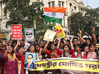 Job seekers and teachers shout slogans demanding the requirement for fifty thousand vacant posts as they take part in a protest march in Kol...