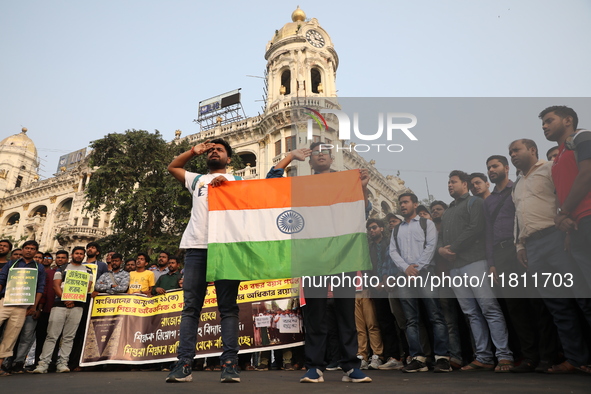 Job seekers and teachers shout slogans demanding the requirement for fifty thousand vacant posts as they take part in a protest march in Kol...