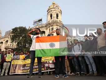 Job seekers and teachers shout slogans demanding the requirement for fifty thousand vacant posts as they take part in a protest march in Kol...