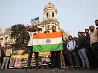 Job seekers and teachers shout slogans demanding the requirement for fifty thousand vacant posts as they take part in a protest march in Kol...