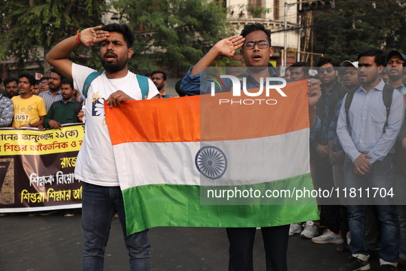 Job seekers and teachers shout slogans demanding the requirement for fifty thousand vacant posts as they take part in a protest march in Kol...