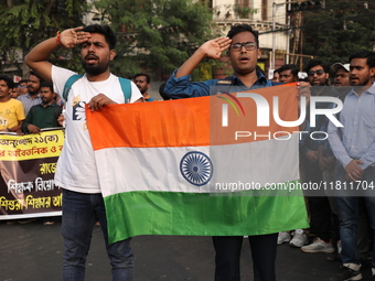 Job seekers and teachers shout slogans demanding the requirement for fifty thousand vacant posts as they take part in a protest march in Kol...