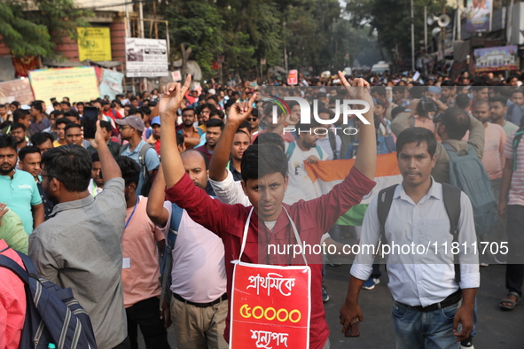 Job seekers and teachers shout slogans demanding the requirement for fifty thousand vacant posts as they take part in a protest march in Kol...