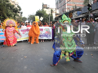 Job seekers and teachers shout slogans demanding the requirement for fifty thousand vacant posts as they take part in a protest march in Kol...