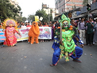 Job seekers and teachers shout slogans demanding the requirement for fifty thousand vacant posts as they take part in a protest march in Kol...