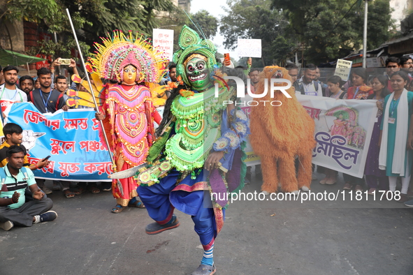 Job seekers and teachers shout slogans demanding the requirement for fifty thousand vacant posts as they take part in a protest march in Kol...