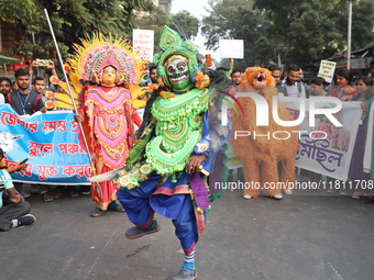 Job seekers and teachers shout slogans demanding the requirement for fifty thousand vacant posts as they take part in a protest march in Kol...