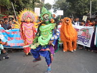 Job seekers and teachers shout slogans demanding the requirement for fifty thousand vacant posts as they take part in a protest march in Kol...