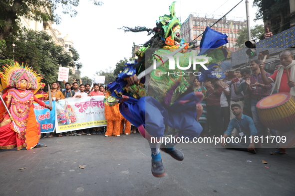 Job seekers and teachers shout slogans demanding the requirement for fifty thousand vacant posts as they take part in a protest march in Kol...