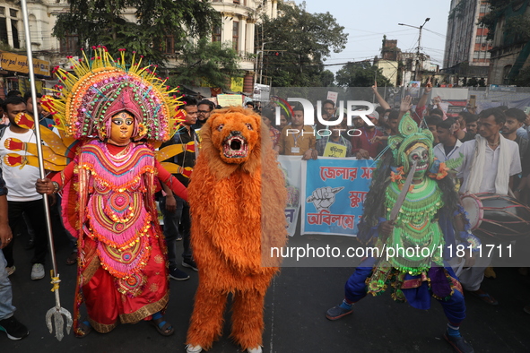 Job seekers and teachers shout slogans demanding the requirement for fifty thousand vacant posts as they take part in a protest march in Kol...