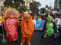 Job seekers and teachers shout slogans demanding the requirement for fifty thousand vacant posts as they take part in a protest march in Kol...