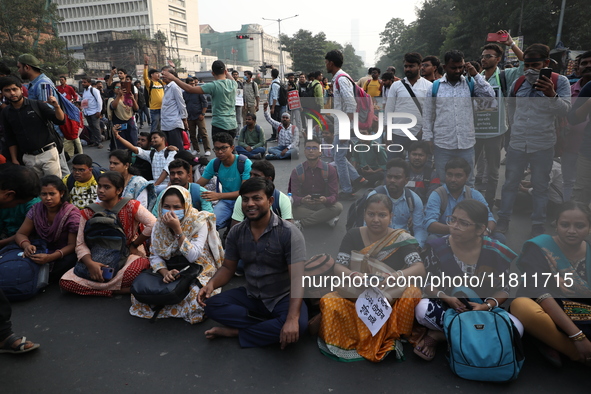 Job seekers and teachers shout slogans demanding the requirement for fifty thousand vacant posts as they take part in a protest march in Kol...