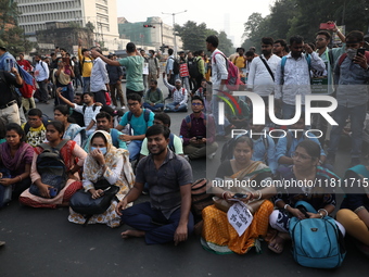 Job seekers and teachers shout slogans demanding the requirement for fifty thousand vacant posts as they take part in a protest march in Kol...