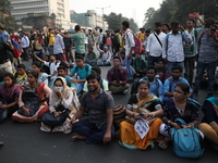 Job seekers and teachers shout slogans demanding the requirement for fifty thousand vacant posts as they take part in a protest march in Kol...