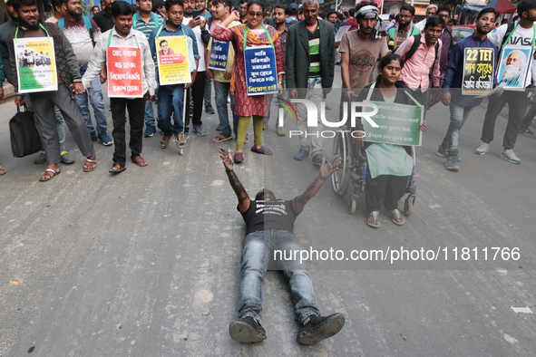 An unemployed primary teacher takes out a rally in Kolkata, India, on November 26, 2024, and blocks the arterial Dorina crossing in the hear...