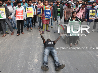 An unemployed primary teacher takes out a rally in Kolkata, India, on November 26, 2024, and blocks the arterial Dorina crossing in the hear...