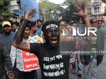 An unemployed primary teacher takes out a rally in Kolkata, India, on November 26, 2024, and blocks the arterial Dorina crossing in the hear...