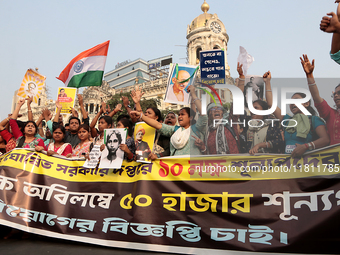 An unemployed primary teacher takes out a rally in Kolkata, India, on November 26, 2024, and blocks the arterial Dorina crossing in the hear...