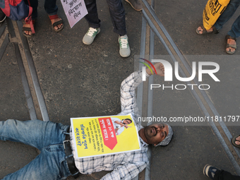 An unemployed primary teacher takes out a rally in Kolkata, India, on November 26, 2024, and blocks the arterial Dorina crossing in the hear...