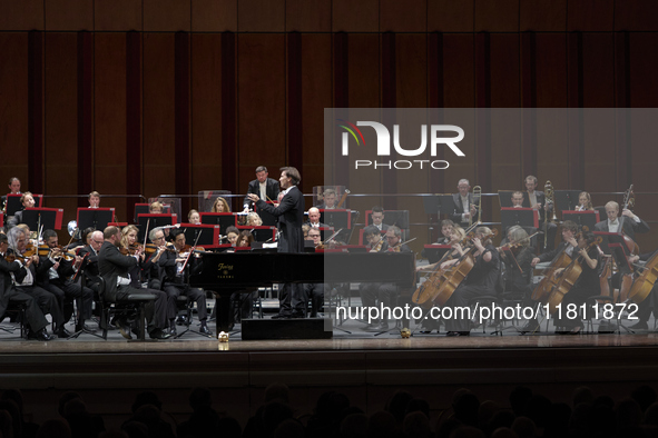 The London Philharmonic Orchestra, conducted by Alessandro Crudele, performs at the historic Teatro Petruzzelli in Bari, Italy, on November...