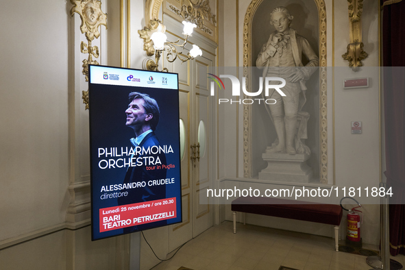 The London Philharmonic Orchestra, conducted by Alessandro Crudele, performs at the historic Teatro Petruzzelli in Bari, Italy, on November...