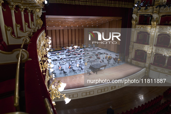 The London Philharmonic Orchestra, conducted by Alessandro Crudele, performs at the historic Teatro Petruzzelli in Bari, Italy, on November...