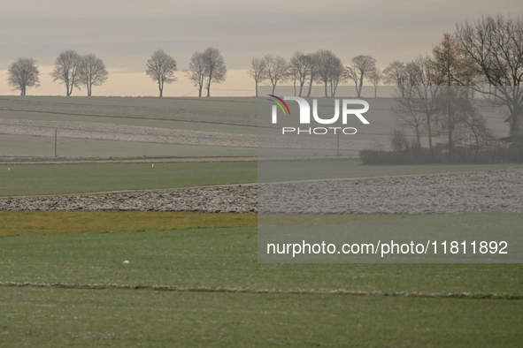 KRAKOW, POLAND - NOVEMBER 19:   
A typical November landscape with grey frozen fields and leafless trees, seen from a Krakow-Warsaw train wi...