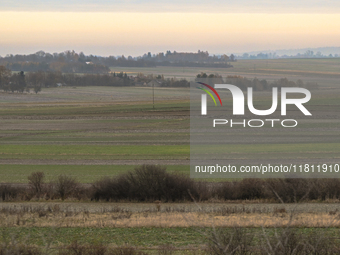 KRAKOW, POLAND - NOVEMBER 19:   
A typical November landscape with grey frozen fields and leafless trees, seen from a Krakow-Warsaw train wi...