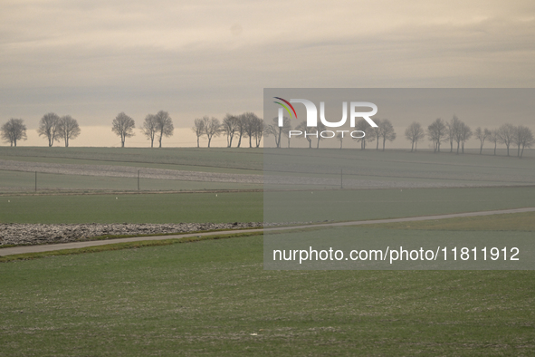 KRAKOW, POLAND - NOVEMBER 19:   
A typical November landscape with grey frozen fields and leafless trees, seen from a Krakow-Warsaw train wi...