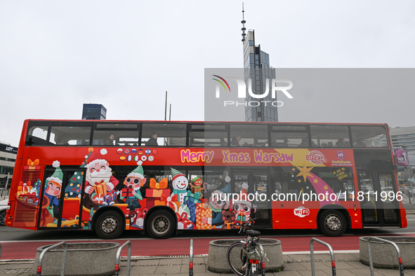 WARSAW, POLAND - NOVEMBER 19:   
A Warsaw tour bus driving through central Warsaw, on November 19, 2024 in Warsaw, Poland. 