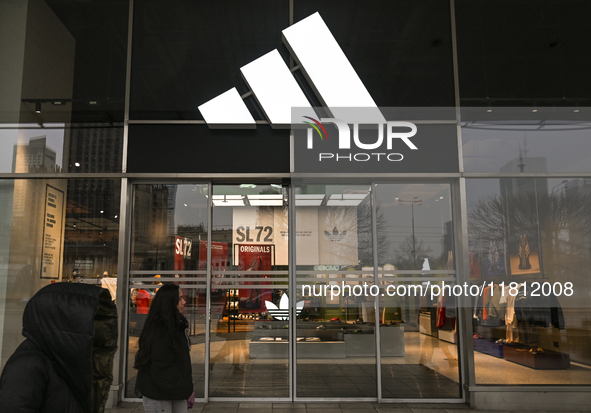 WARSAW, POLAND - NOVEMBER 19:   
The Adidas logo displayed on a store facade, on November 19, 2024 in Warsaw, Poland. 