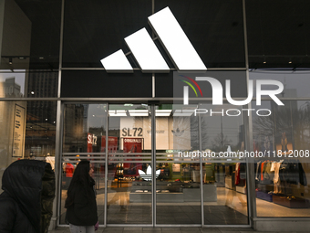 WARSAW, POLAND - NOVEMBER 19:   
The Adidas logo displayed on a store facade, on November 19, 2024 in Warsaw, Poland. (