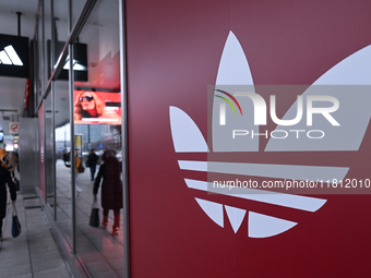 WARSAW, POLAND - NOVEMBER 19:   
The Adidas logo displayed on a store facade, on November 19, 2024 in Warsaw, Poland. (