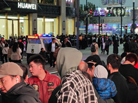 A large number of customers line up to buy new mobile phones outside Huawei's flagship store in Shanghai, China, on November 26, 2024. Some...