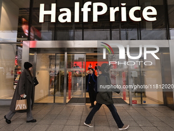 WARSAW, POLAND - NOVEMBER 19:   
The 'Half Price' logo displayed at the entrance to a retail store, on November 19, 2024 in Warsaw, Poland....