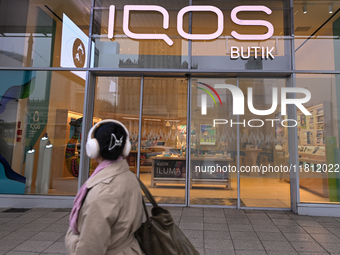 WARSAW, POLAND - NOVEMBER 19:   
The IQOS Butik logo displayed at the entrance to a retail store, on November 19, 2024 in Warsaw, Poland. (