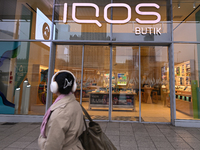 WARSAW, POLAND - NOVEMBER 19:   
The IQOS Butik logo displayed at the entrance to a retail store, on November 19, 2024 in Warsaw, Poland. (