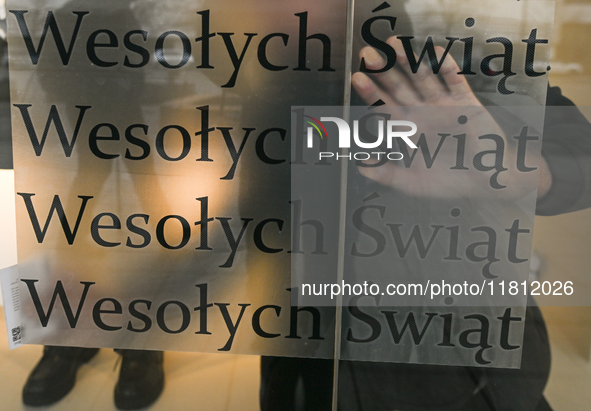 WARSAW, POLAND - NOVEMBER 19:   
Happy Christmas'' (Polish: ''Wesolych Swiat'') stickers placed in a shop window, ready for the holiday seas...